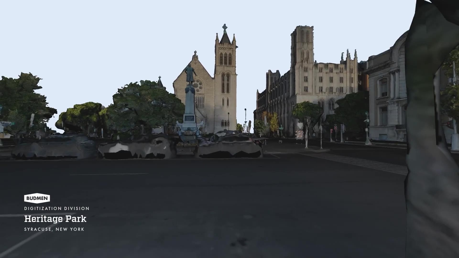 Still from inside the 3D model: looking across the plaza toward the monument and the cathedral, with melted scan forms of parked cars along the curb