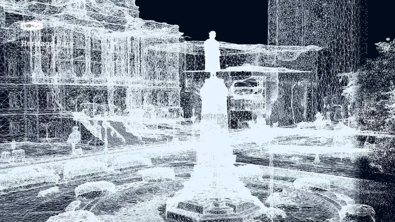The 3D model drawn as a pale blue wireframe: the monument and the buildings around the circle on a dark ground